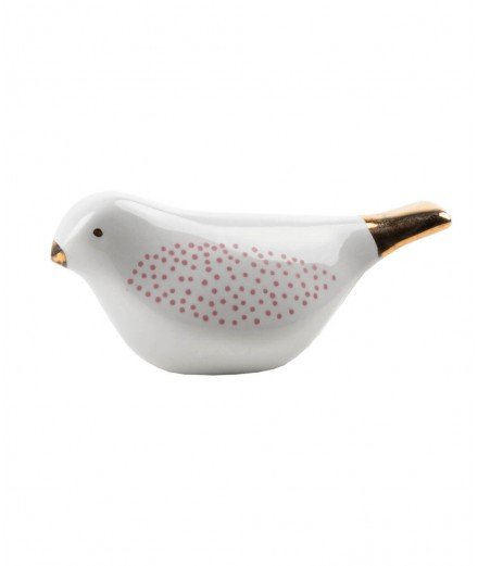 Oiseau en porcelaine de la marque de décoration Räder. Il présente de beaux détails rose et doré.