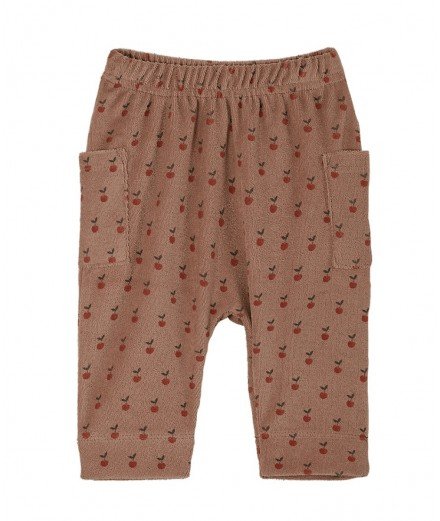 Pantalon en tissu éponge Terracotta avec des petites Pommes en motif. De la marque Emile et Ida