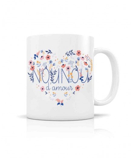 Mug en céramique blanche avec le message "Nounou d'Amour" accompagné de petites fleurs. De la créatrice Créa-bisontine.