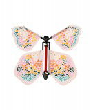 Papillon magique rose de la marque Rex London. Enroulez son élastique et il s'envolera !