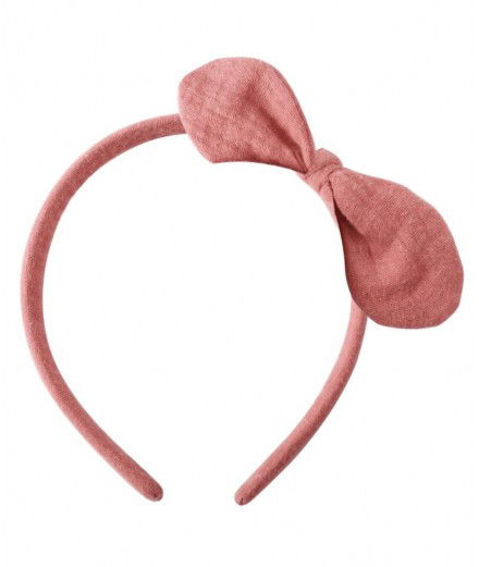 Serre-tête pour enfant avec un noeud en gaze de coton rose. De la marque française Luciole et Petit Pois.